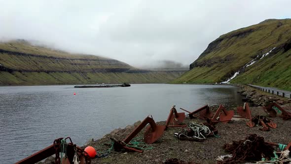 Old Rusty Anchors Near the Fjord