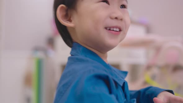 happy child boy smile laugh fun moving dance cheerful wear casual cloth alt