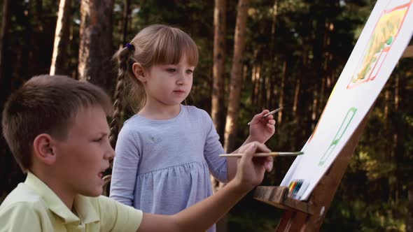 Happy Family Young Parents Drawing Coloring Picture with Brush Helping Cute Child Daughter Enjoying alt
