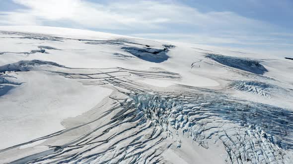 Aerial drone view climate change causing a glacier to melt, in sunny Iceland alt