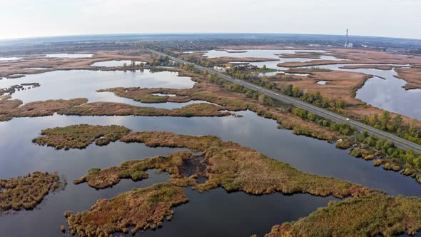 The Road Passes Through the Samarskie Plavni Picturesque Ukraine in the Evening Light alt