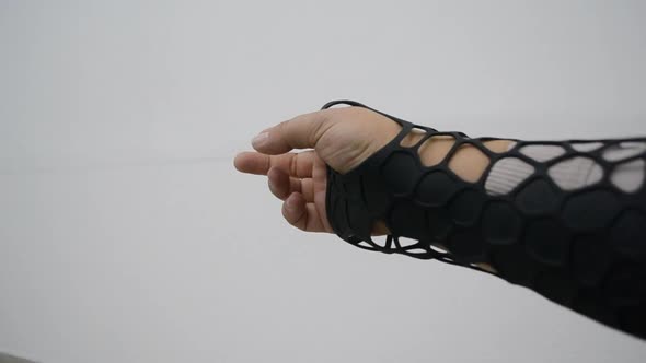Black Orthopedic Plastic Prosthesis Printed on Powder 3D Printer on Hand alt