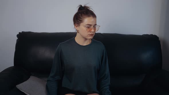 The Thoughtful Young Woman Thoughtfully Looking for a Solution Then Raised the Light Bulb and Smiled alt