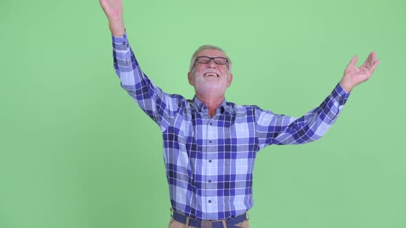 Happy Senior Bearded Hipster Man Catching Something alt