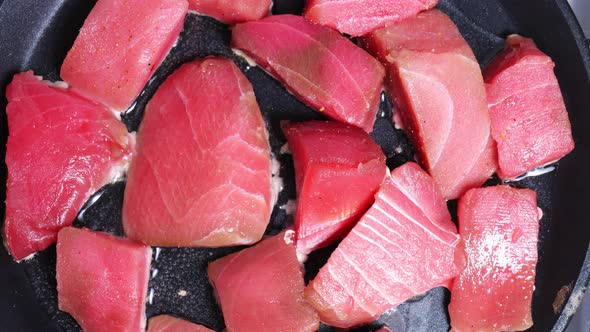 Chunks of Fresh Tuna Are Cooked in a Hot Skillet