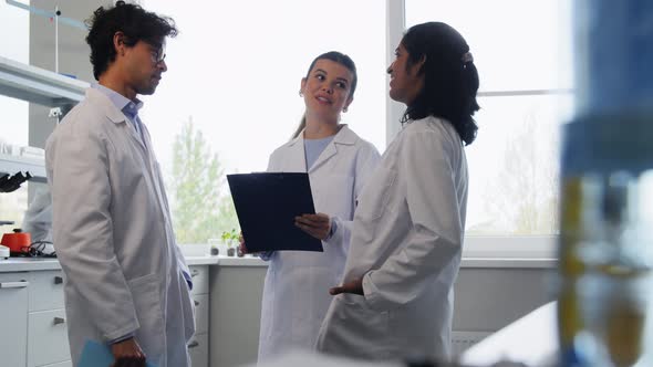 International Group of Scientists in Laboratory alt