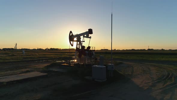 Fuel Production, Oil Pump, Pumping Oil in Field, View From Height, Sunset Light alt