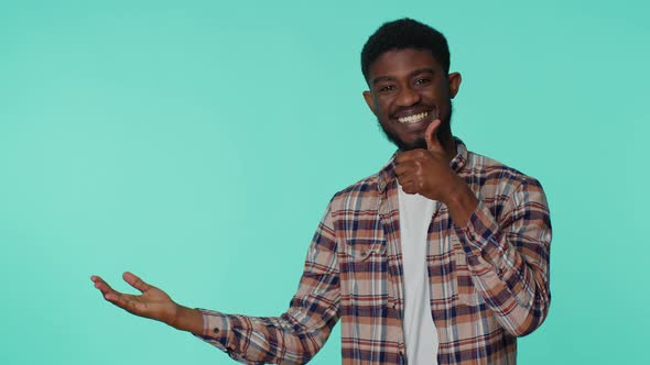 Man Pointing Empty Place Advertising Area for Commercial Text Copy Space for Goods Promotion alt