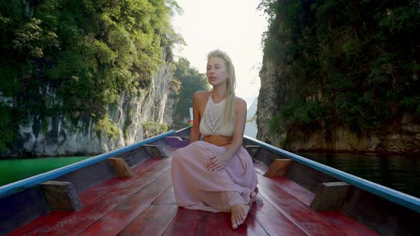 Model with Knitted Bra on Canoe alt