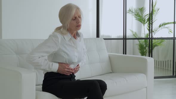An Elderly Woman Suffers From Abdominal Pain a Mature Elderly Adult Woman Feels Abdominal Pain While alt