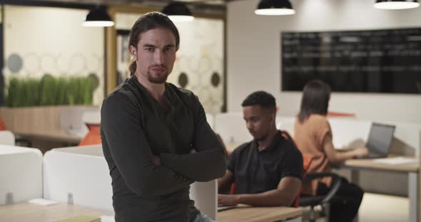 Confident Employee in Coworking Space alt