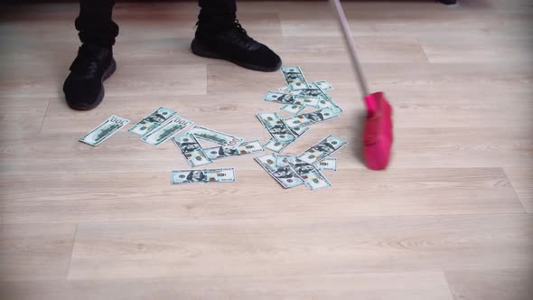 Sweep money on the floor with a brush.