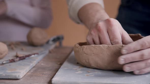 Ceramist Person Working with Clay in Pottery Workshop Studio
