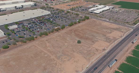 Aerial view of logistics center next to the highway in the field near the road alt