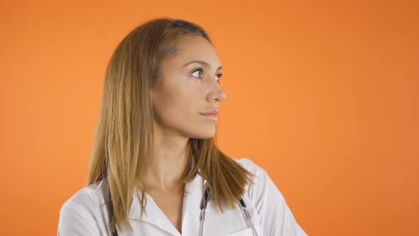 Close Shot, Portrait of Beautiful Young Women Doctor in White Coat and Stethoscope on Shoulders alt