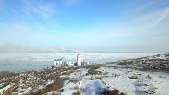 Industrial Plant Near Sea Bay Village At Winter