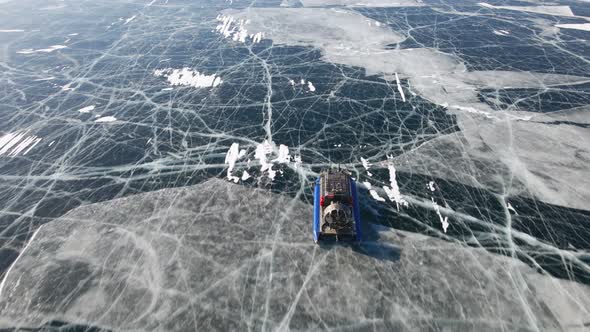 Hovercraft Gliding on Beautiful Frozen Ice Surface of Baikal Lake in Winter in Russia