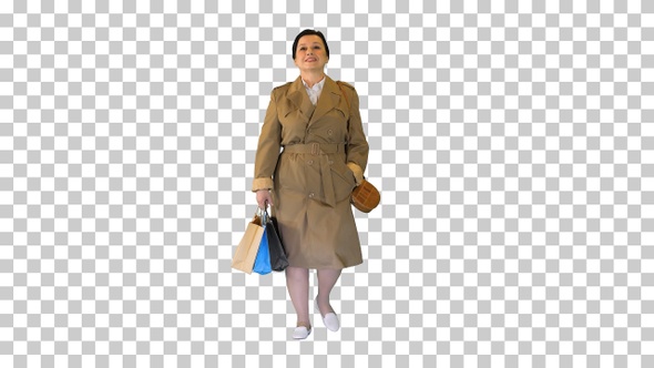 Mature brunette woman in a coat with shopping, Alpha Channel alt