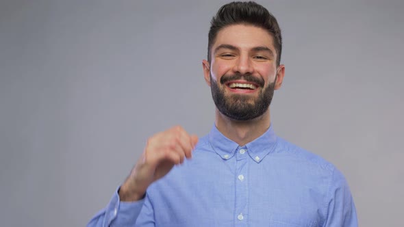 Portrait of Happy Young Man Showing Thumbs Up alt