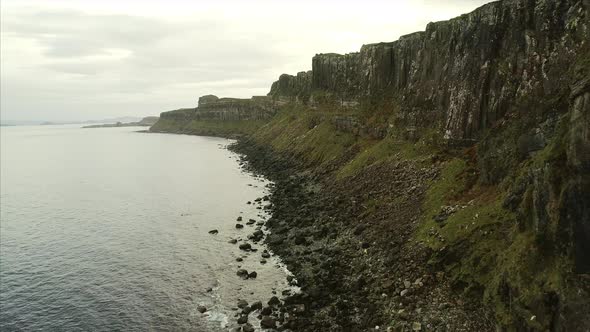 Flying by the Cliffs and Bay Near Neist Point in Skye Scotland alt
