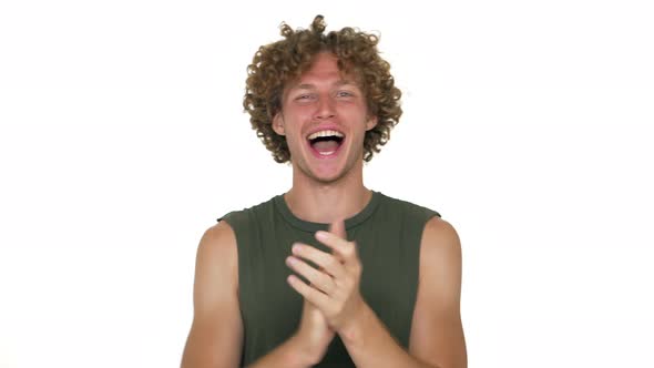American Optimistic Curly Guy in Green Muscle Shirt Shouting Happily Clapping Showing Thumb Up Over alt