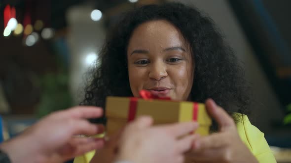Closeup Portrait of a Beautiful Cute Young Girl Receives a Gift Box She is Happy and Enjoying the