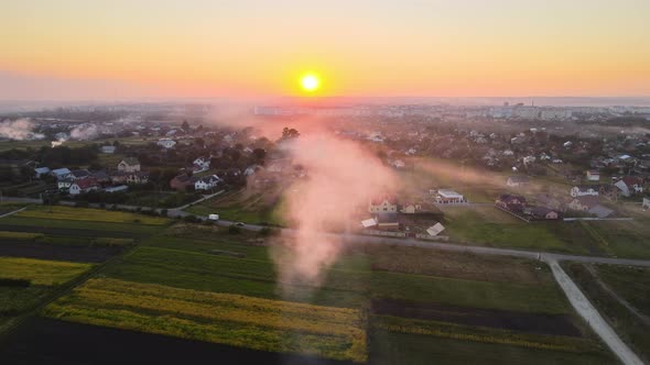 Aerial View of Agricultural Waste Bonfires From Dry Grass and Straw Stubble Burning with Thick Smoke alt