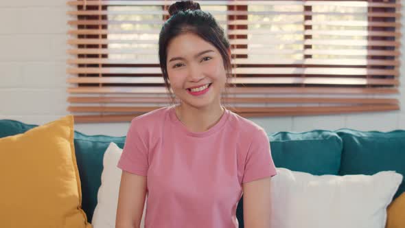 Portrait Asian Chinese woman feeling happy smiling at home. alt