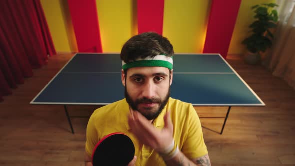 Funny Ping Pong Player Looking Straight to the alt