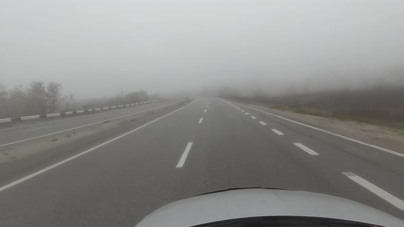 Pov Driving on Foggy Road at Autumn