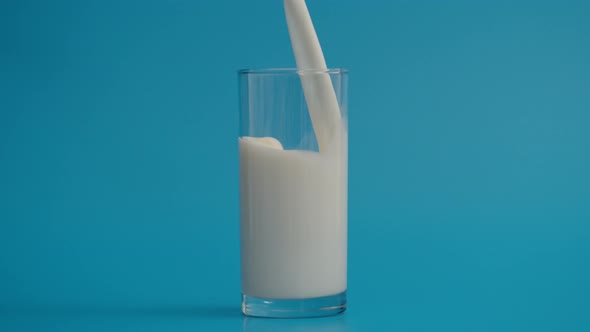 Slow Motion of Pouring Milk in Full Glass at 1000 Fps alt