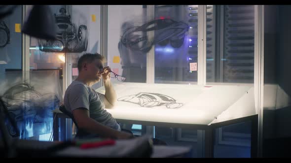 Car Designer Taking a Short Break During Work alt