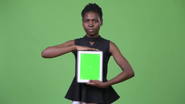 Young Beautiful African Businesswoman Showing Digital Tablet