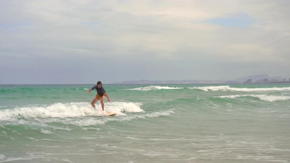 A Young Man Learns How To Surf alt