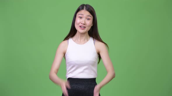 Young Beautiful Asian Businesswoman Clapping Hands