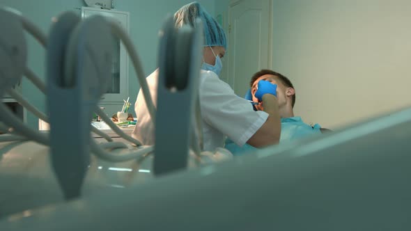 Dentist treats Teeth of Young Guy