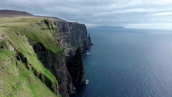 Sliding Camera Over the Steep Coastline in Faroe Islands