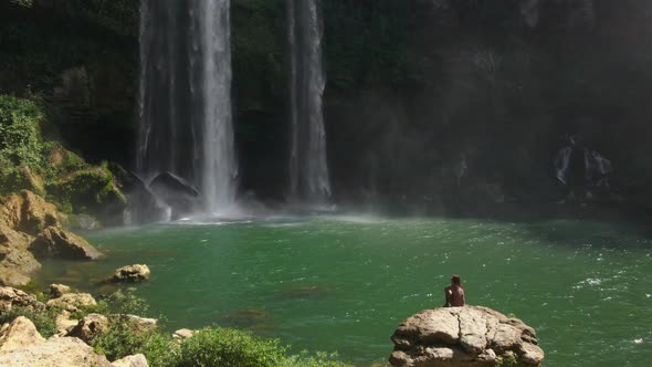 Female Tourist Enjoing the View of MisohHa Waterfall in Chiapas Mexico
