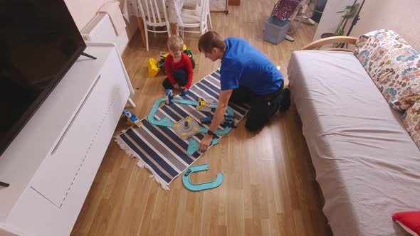 Man Playing With Boy alt