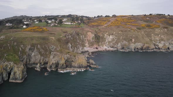 Walking Trail On Cliff Near Welton's Bay In Howth, Dublin, Ireland. aerial drone alt