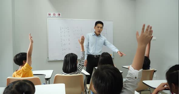 Teacher teaching children in the classroom alt