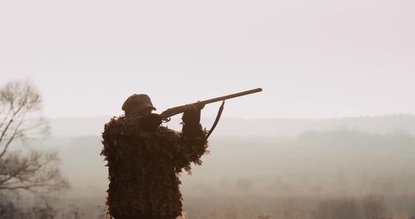 Portrait of Hunter in Hunting Equipment alt