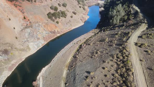 Slowly flying over the North Fork American river in the Sierra Nevada.Camera tilting down while flyi alt