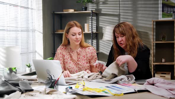 Happy Young Business Women Designers Using Laptop Taking Online Shop Orders in Atelier Office alt
