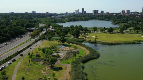 aerial pull away & descending shot at Flushing Meadows-Corona Park in Flushing, New York. It is a su alt