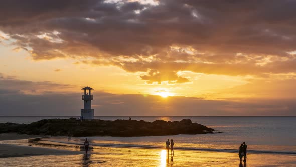 Khao Lak beach with light lighthouse, Phang-Nga, Thailand; day to night - Time Lapse