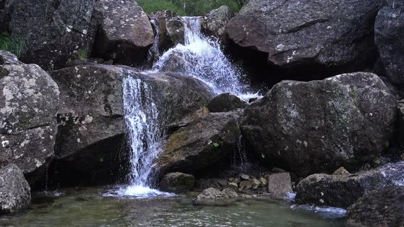Waterfall on Mountain River.
