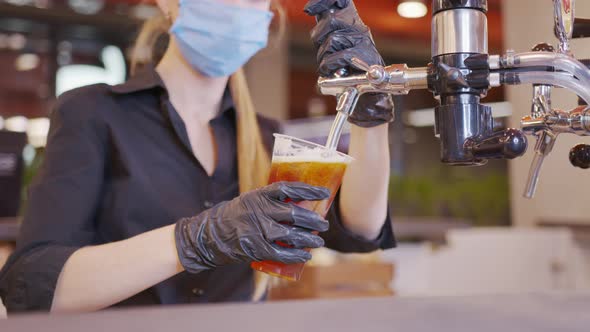 Pouring Cold Beer Into Glass alt