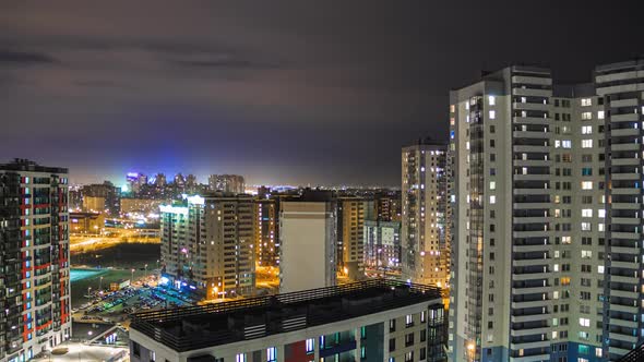 residential buildings at night. timelapse of the night city. living quarters, apartments alt