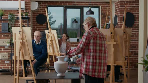 Multiethnic Group of People Attending Art Class Lesson alt